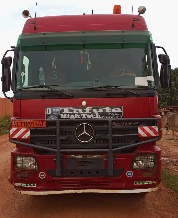 Front view of a Mercedes Actros long-haul truck on a laterite road in Cameroon