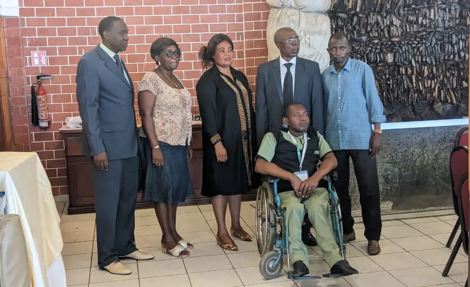 Transconnecta colleagues, including a team member who uses a wheelchair, at a staff meeting